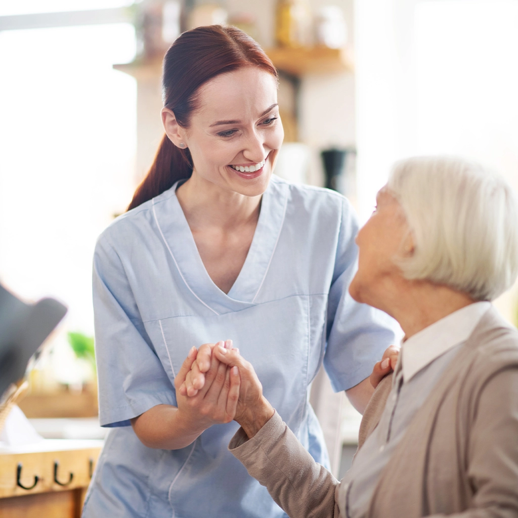 Assisted living caregiver supporting a resident